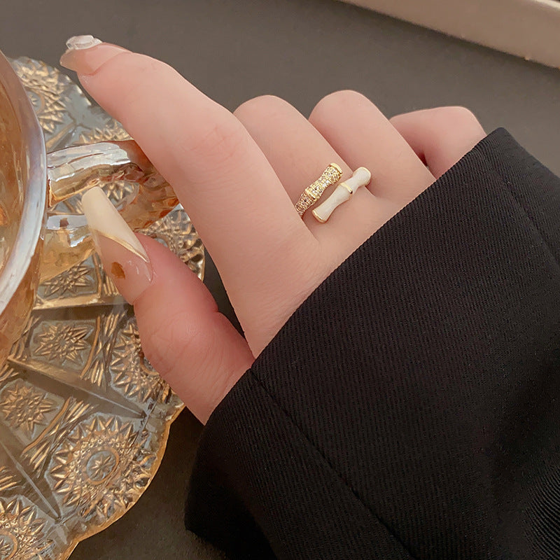 Bamboo style ring with gold and white segments on hand