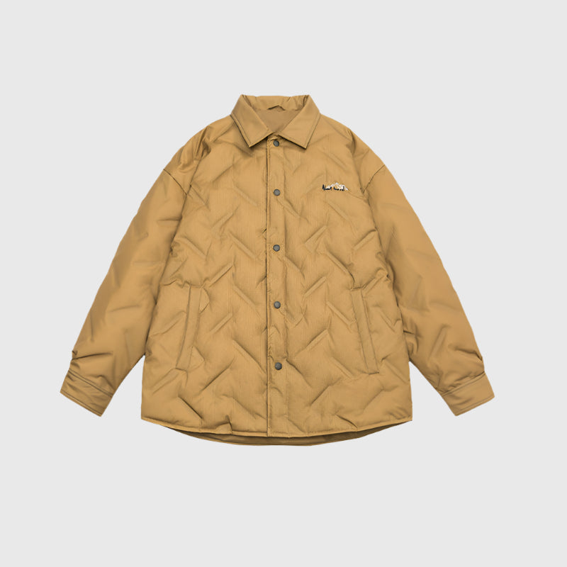 Tan quilted shirt jacket with collar and embroidered mountain logo displayed flat against light gray background