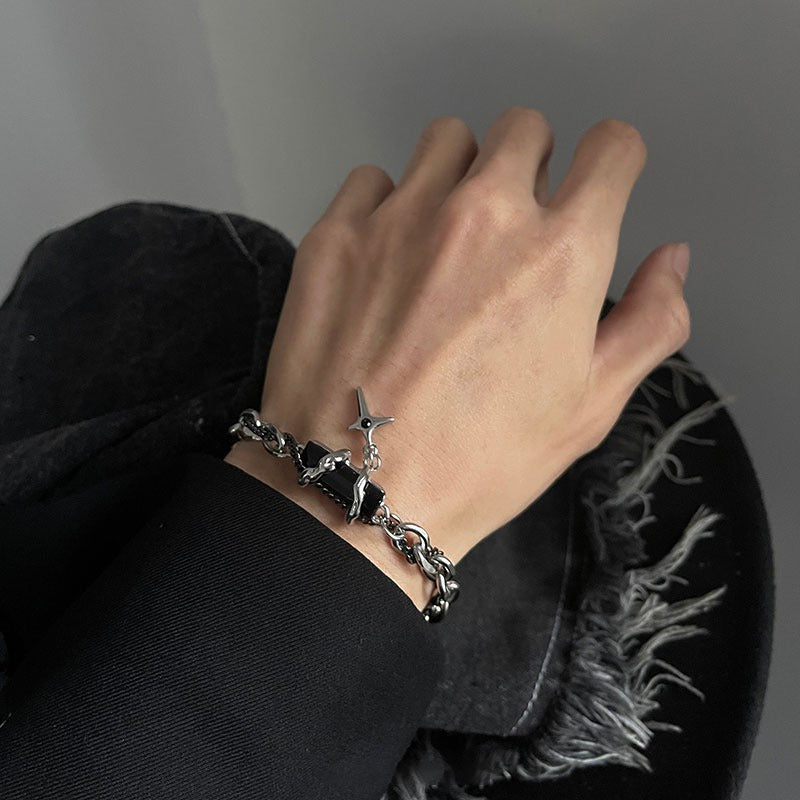 Silver chain bracelet with black detail and star charm