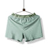 Mint green boxer short with elastic waistband reading 'HELLO' displayed on hanger against white background