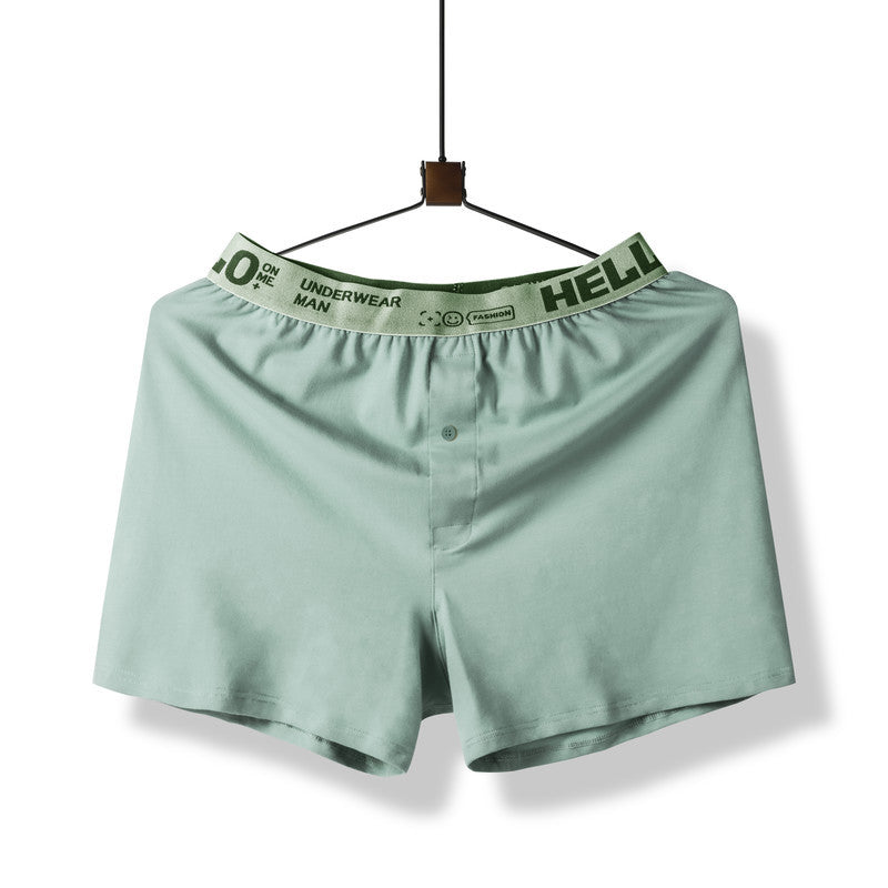 Mint green boxer short with elastic waistband reading 'HELLO' displayed on hanger against white background