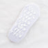 White non-slip ankle sock with white footprint grip pattern on sole displayed flat against white fabric background