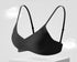 Seamless black soft-support bra with adjustable straps and a breathable, comfortable design.