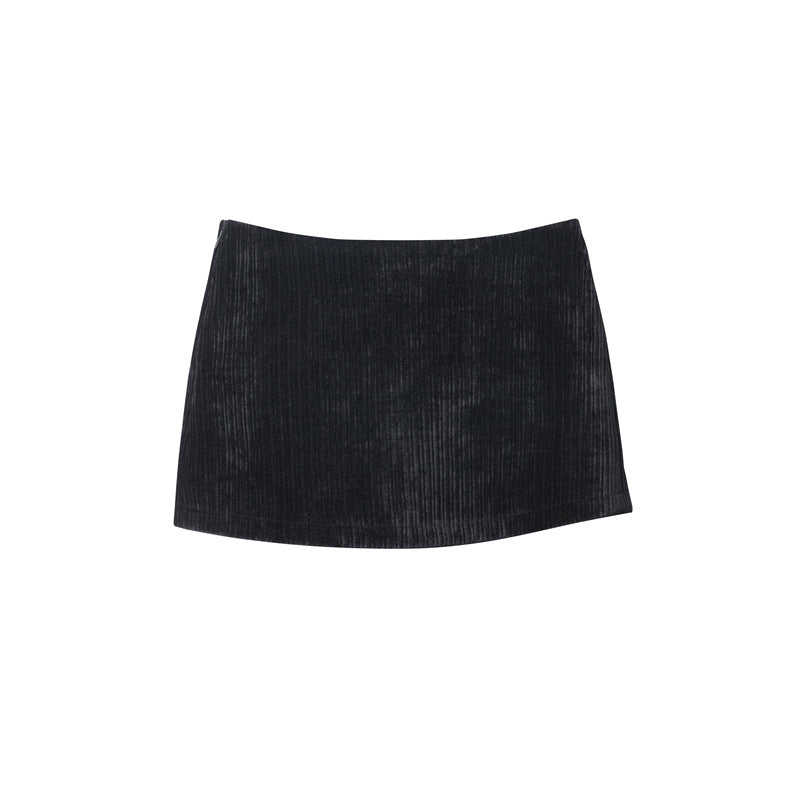 Black ribbed corduroy mini skirt with subtle A-line shape, displayed flat on white background.