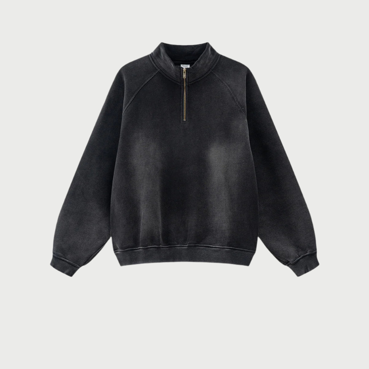 Charcoal black half-zip pullover with vintage fade effect, mock neck, brass zipper, ribbed cuffs, relaxed fit