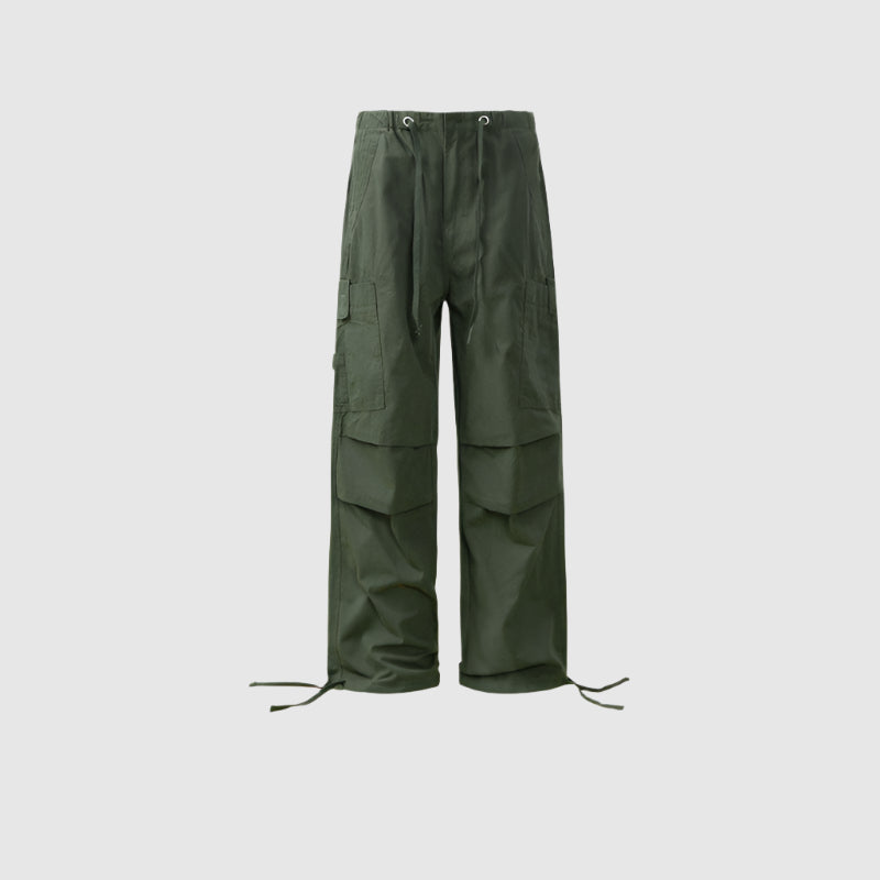 Olive green drawstring cargo pants with tiered panel design and utility pockets displayed flat against light gray background