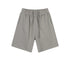 Light gray cotton shorts with elastic waistband and drawstring, featuring clean seams and relaxed fit, displayed flat