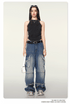 Black fitted tank top with ruched sides shown with distressed jeans