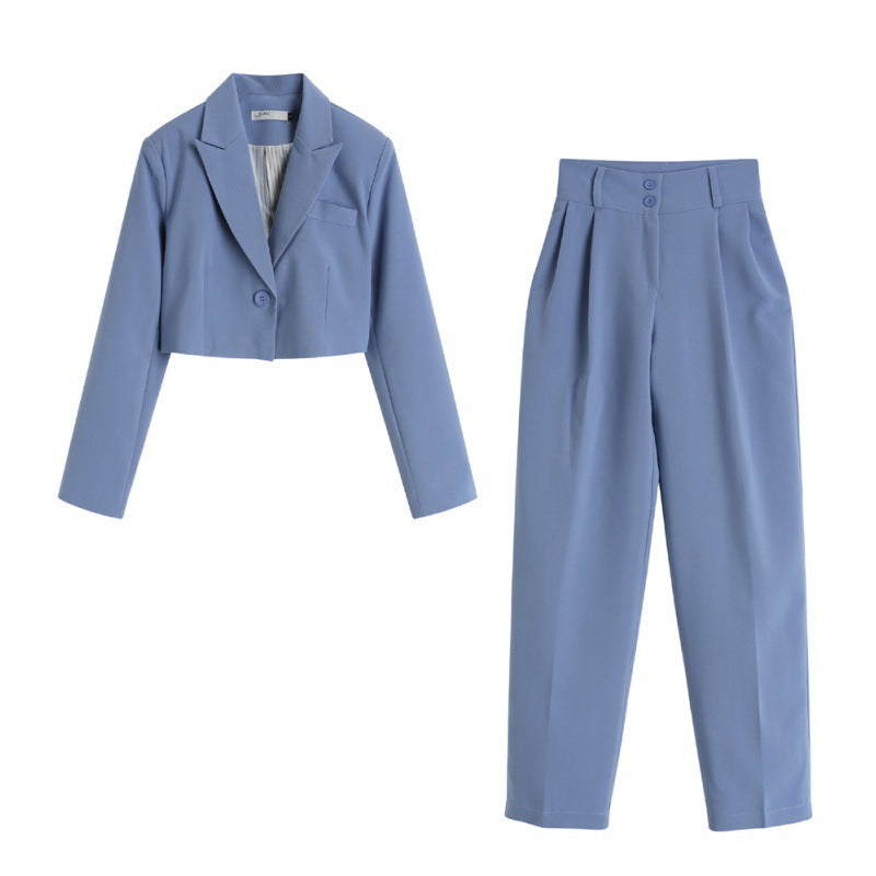 Product photo of light blue cropped blazer and wide-leg pants set with pleated details