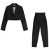 Black two-piece suit set featuring cropped blazer and high-waist pants on white background