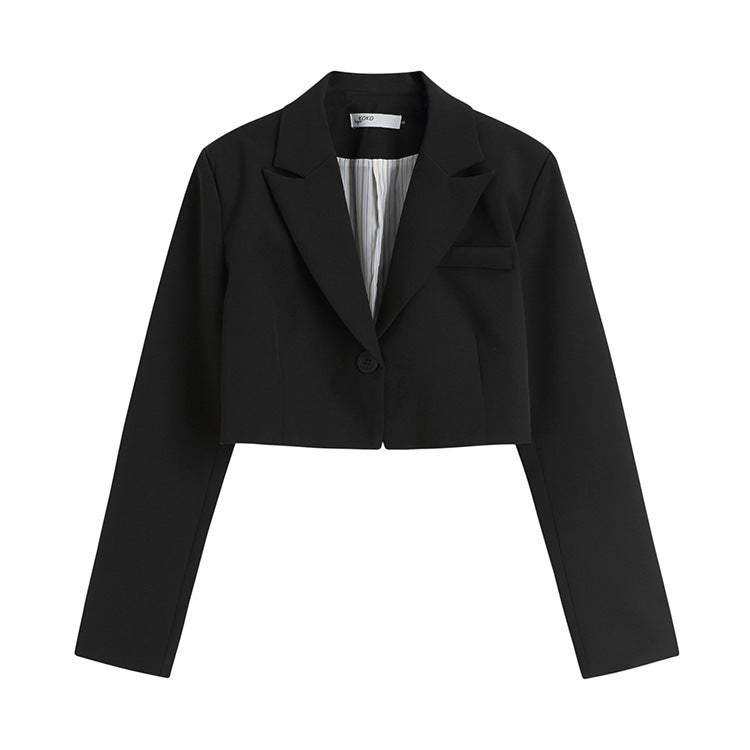 Close-up of black cropped blazer with single button closure and notched lapels