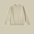 Sand colored crewneck sweatshirt with ribbed collar and cuffs on beige background
