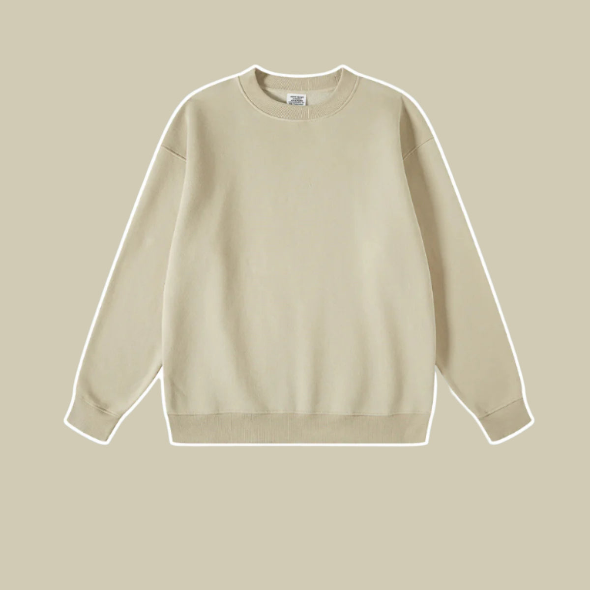 Sand colored crewneck sweatshirt with ribbed collar and cuffs on beige background