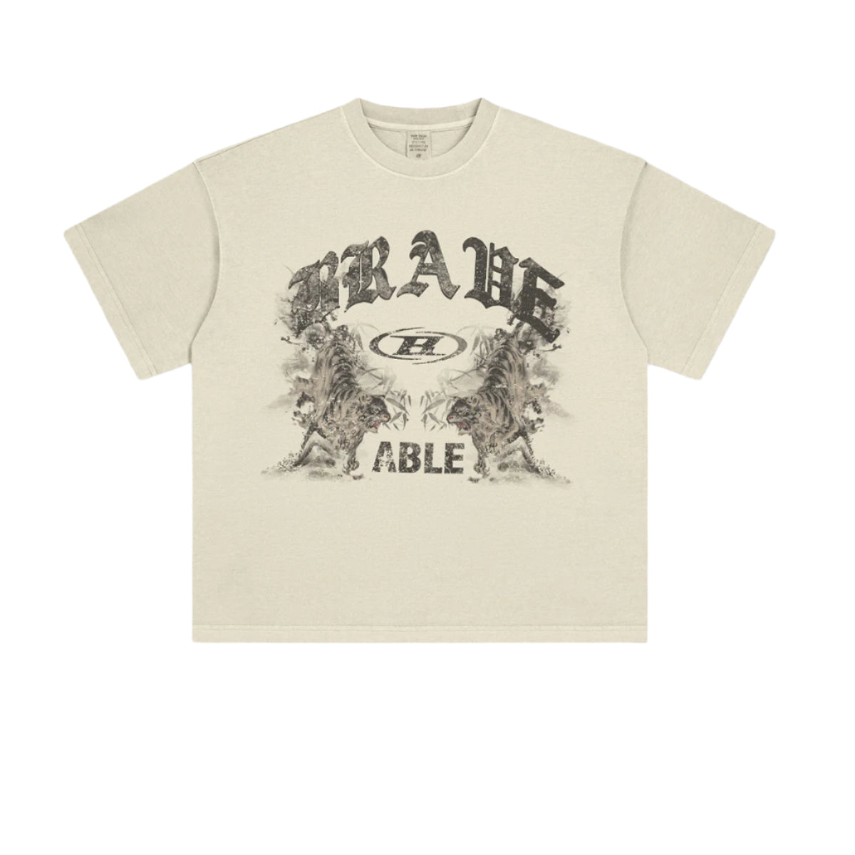 Flat product shot of cream-colored t-shirt featuring "BRAVE ABLE" graphic with tiger designs against white background