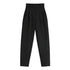 Black high-waist pleated pants with double button closure on white background
