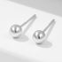 A pair of 925 sterling silver round bead stud earrings with a polished finish, displayed against a white background.