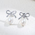 925 silver bow pearl drop earrings ribbon stud design