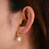 925 silver gold bow pearl earrings front view on ear