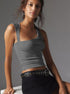Gray asymmetrical top with black studded belt and skirt
