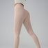 Model wearing taupe athletic leggings and cream top, rear view highlighting seamless design against gray background