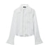 White button-up blouse with wide cuffs and collar, laying flat