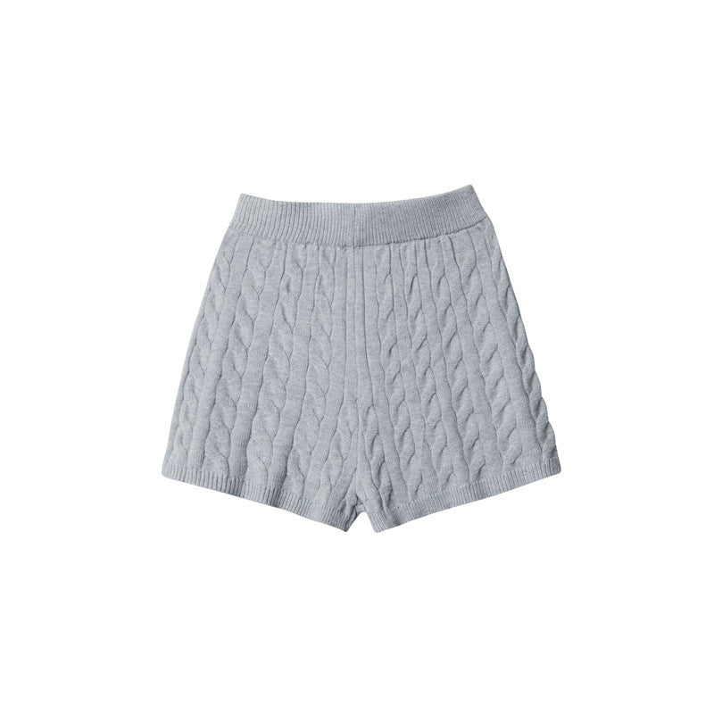 Grey knit shorts with elastic waistband and all-over cable pattern.