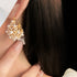 Elegant pearl cluster earrings with gold metalwork
