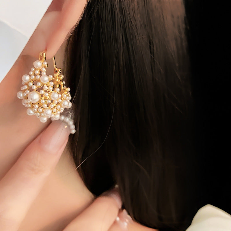 Elegant pearl cluster earrings with gold metalwork