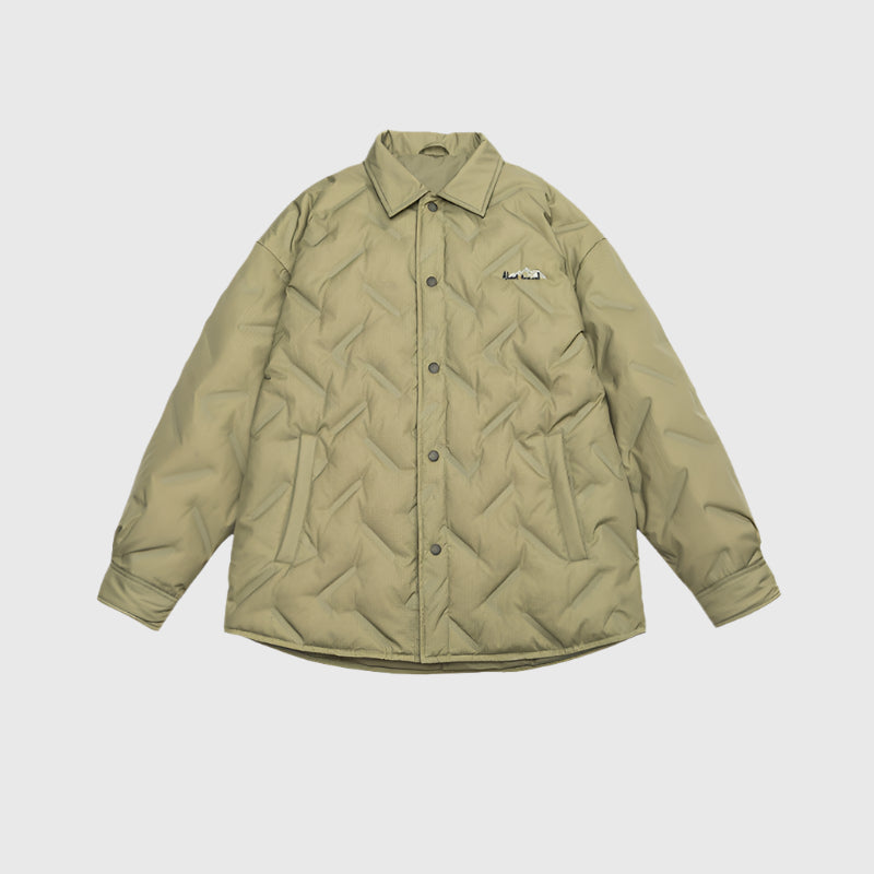 Olive-tan quilted shirt jacket with collar and small embroidered logo displayed flat against light gray background