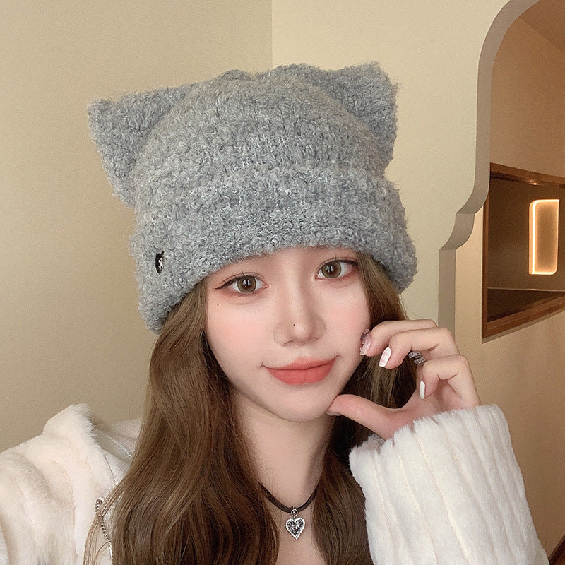 Gray Cat Ear Beanie Hat Styled with Jewelry – Elegant gray cat ear beanie hat paired with a necklace for a fashionable winter look