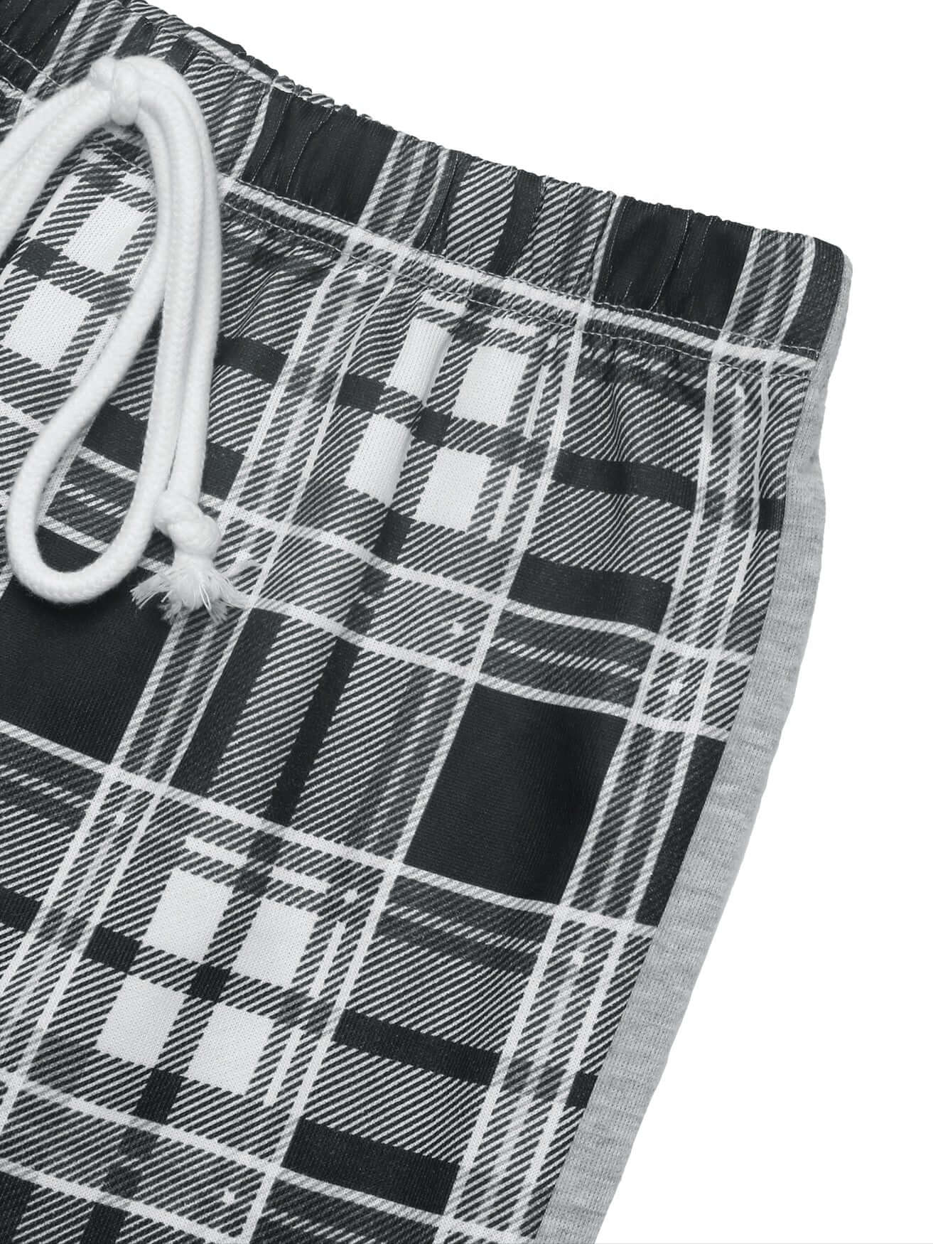 Side view of plaid pants highlighting contrast stitching and elastic waistband detail.