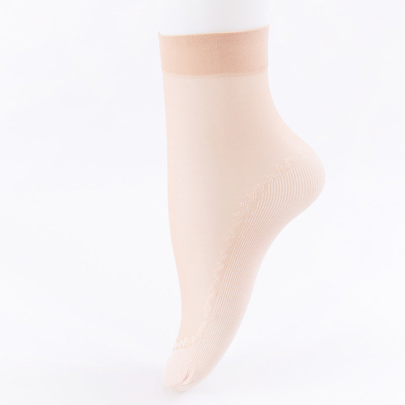 Close-up of beige sheer ankle sock showing delicate ribbed sole pattern
