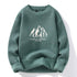 Sage green knit sweater with white mountain logo graphic
