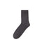 Slate blue sock with a plush, textured surface, positioned vertically