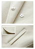 Detail of silver snap buttons and clean edge finishing on coat