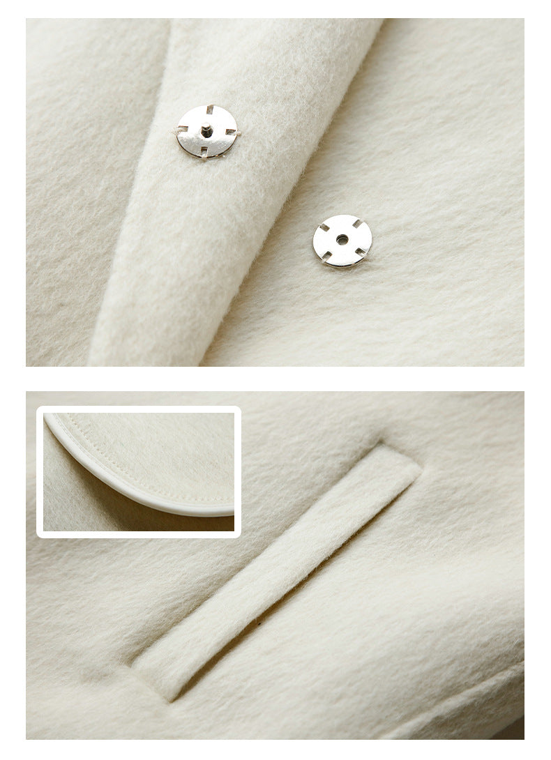 Detail of silver snap buttons and clean edge finishing on coat