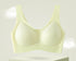 Summer green seamless bra with breathable cups on a pedestal.