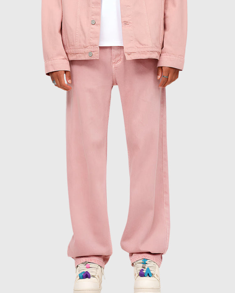 Pink denim set with cropped jacket and wide-leg pants, paired with colorful sneakers