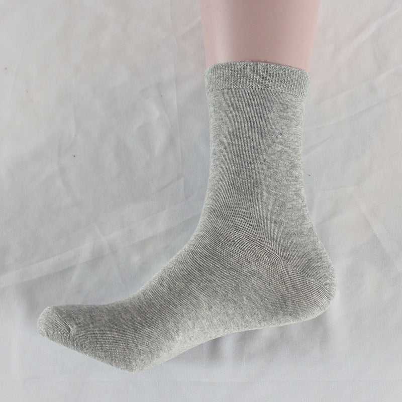 Single light gray cotton crew sock displayed against neutral background, emphasizing neutral color palette