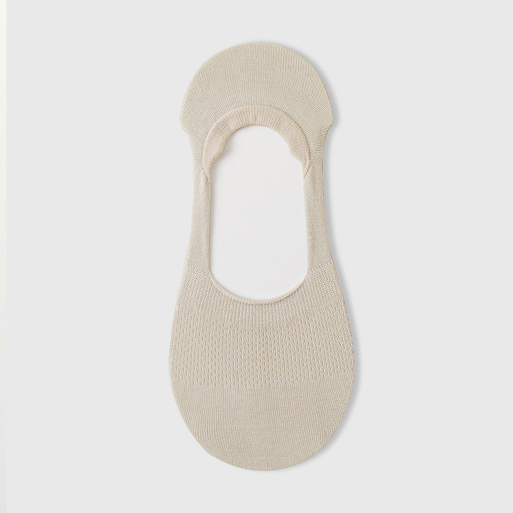 Cream-colored no-show sock liner with ribbed texture and elastic top band, shown on white background