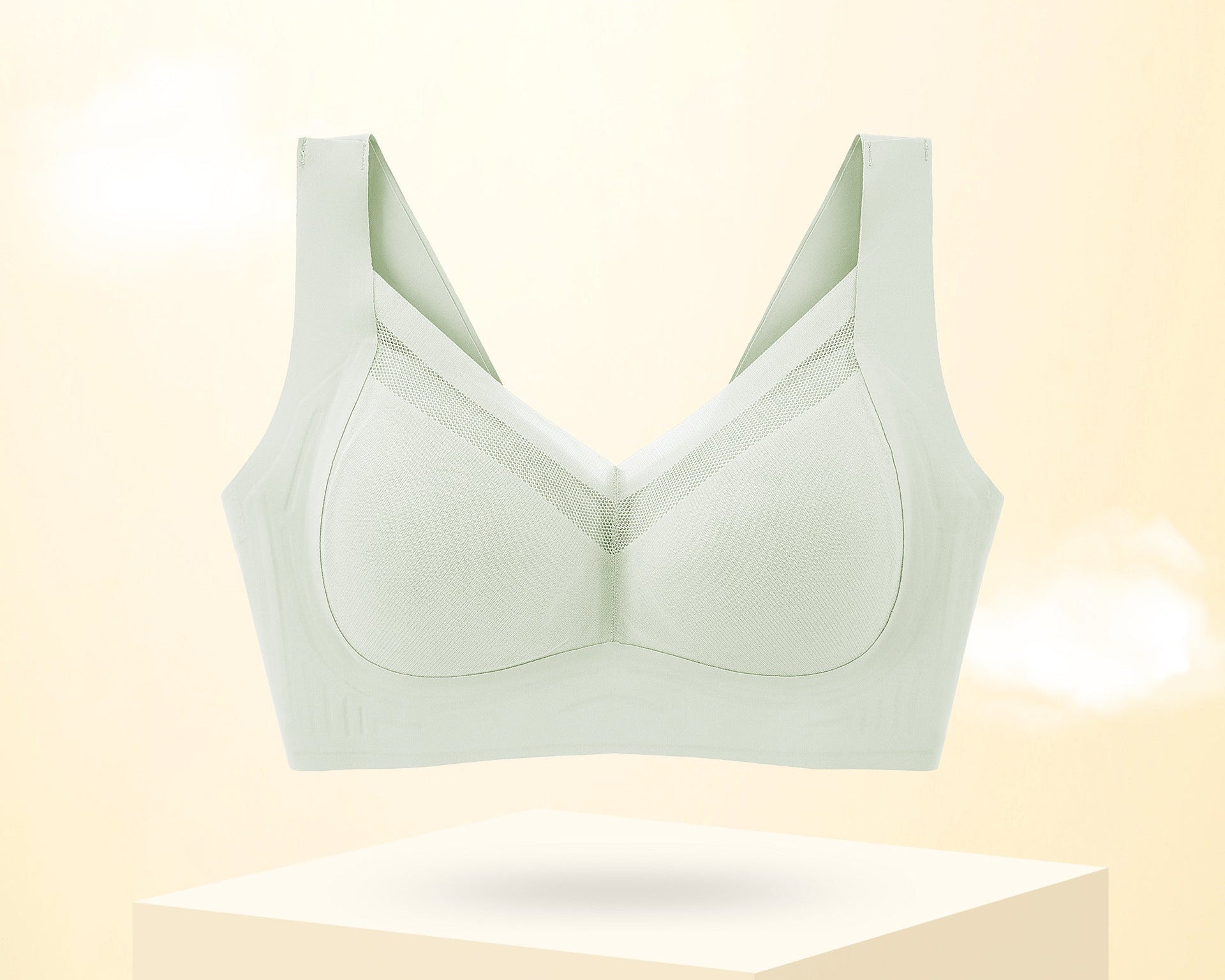 Large-size, thin, breathable bra in mint color with wide straps and seamless design for all-day comfort.
