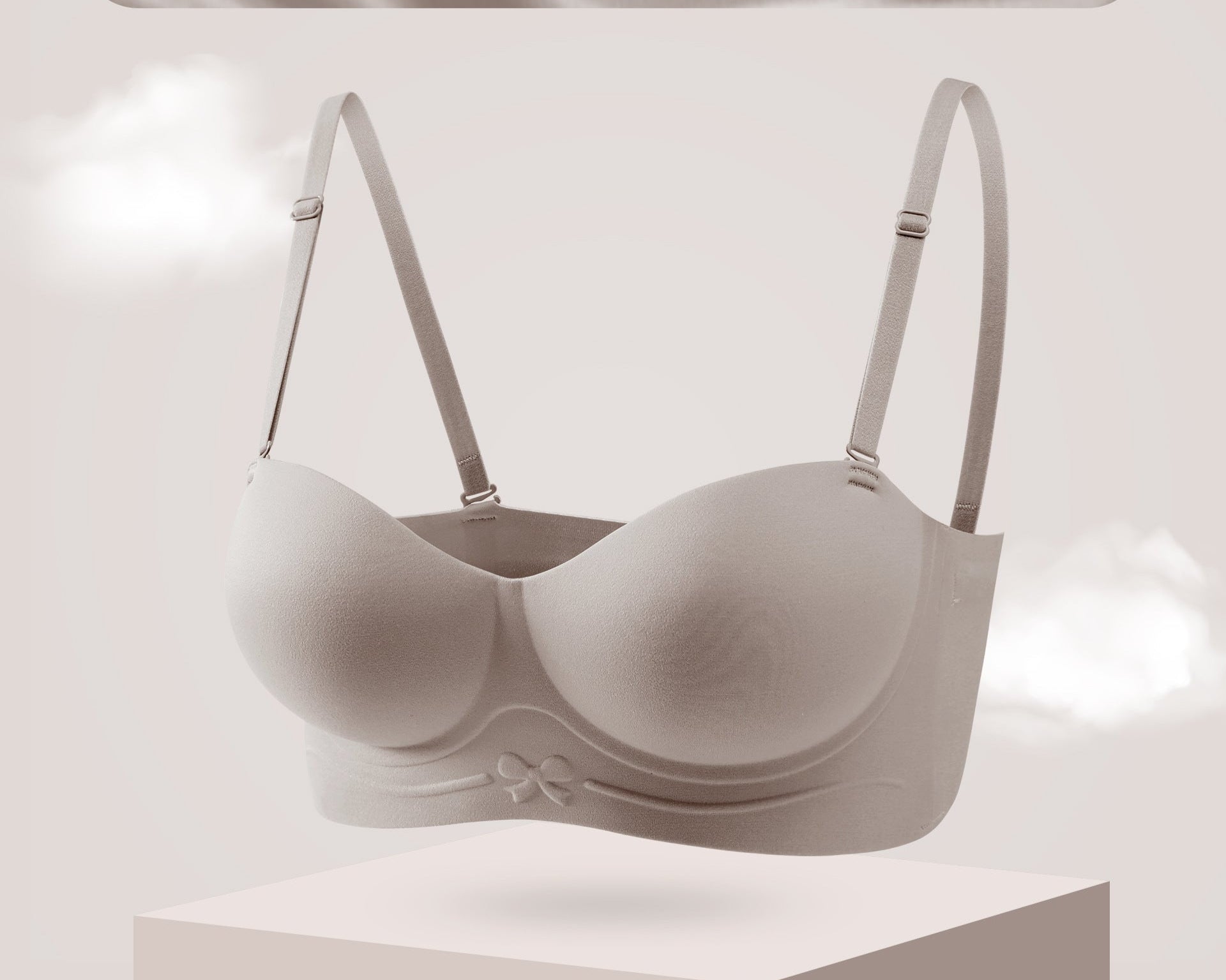 Coffee brown strapless bra with molded cups and a bow detail on the band.
