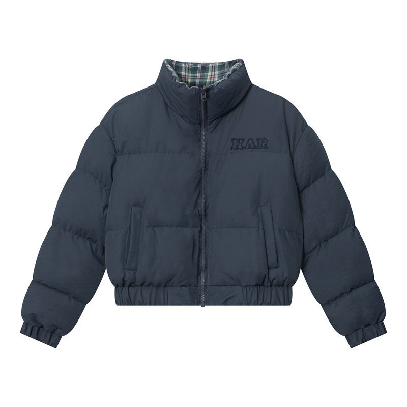 A navy puffer jacket with a green plaid lining, a front zipper, and elastic cuffs, displayed against a white background