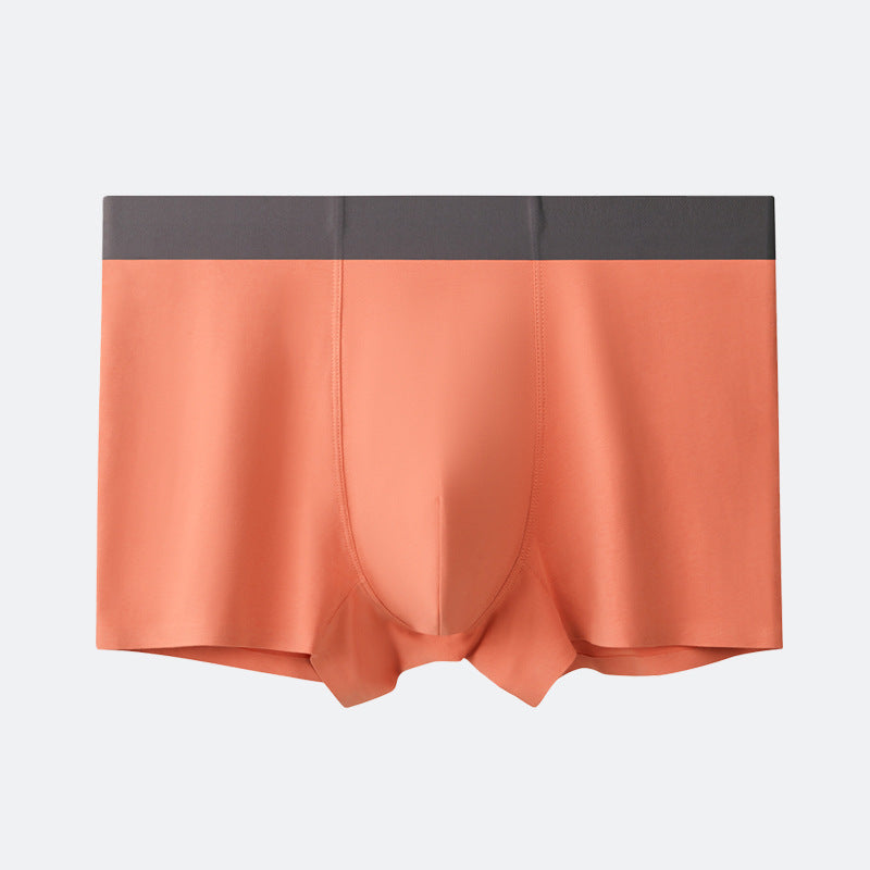 Salmon/peach-toned men's boxer briefs with centered pouch, soft fabric, and dark gray waistband