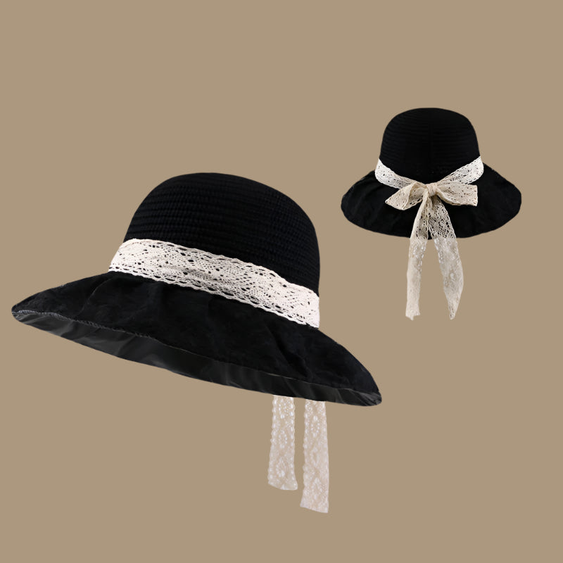 A black woven sun hat with a lace-trimmed brim and a ribbon bow at the back, displayed in two perspectives for showcasing design elements.