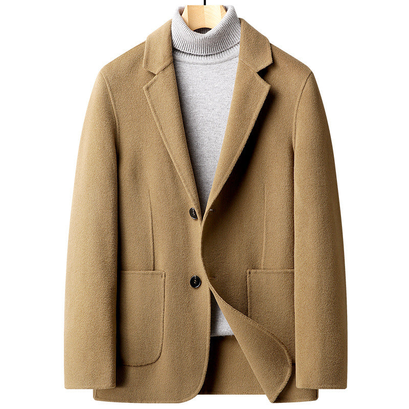 Camel wool blazer with notched lapels and two-button closure, styled with a light gray turtleneck sweater on wooden hanger