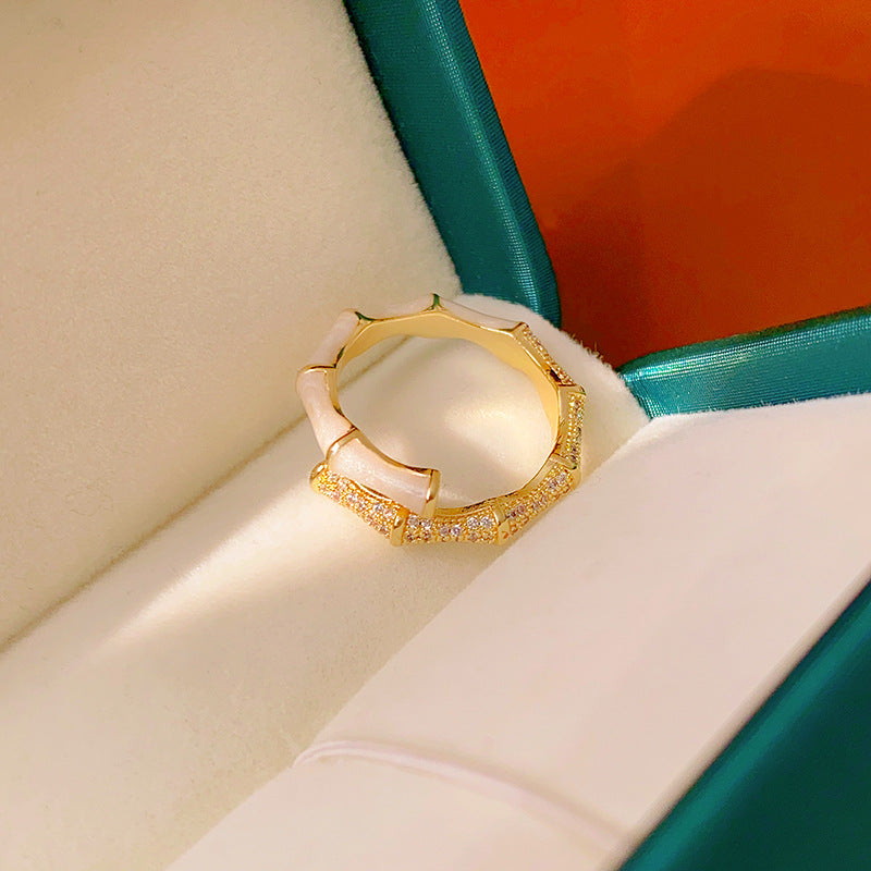 Luxury bamboo design ring with alternating white and gold segments