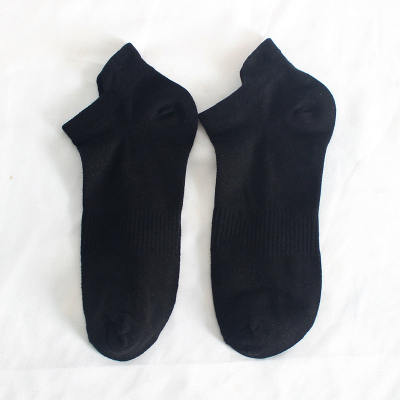 Pair of black athletic ankle socks with ribbed arch support design