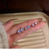 Diamond stud earrings in multiple sizes, ranging from 3mm to 7.5mm
