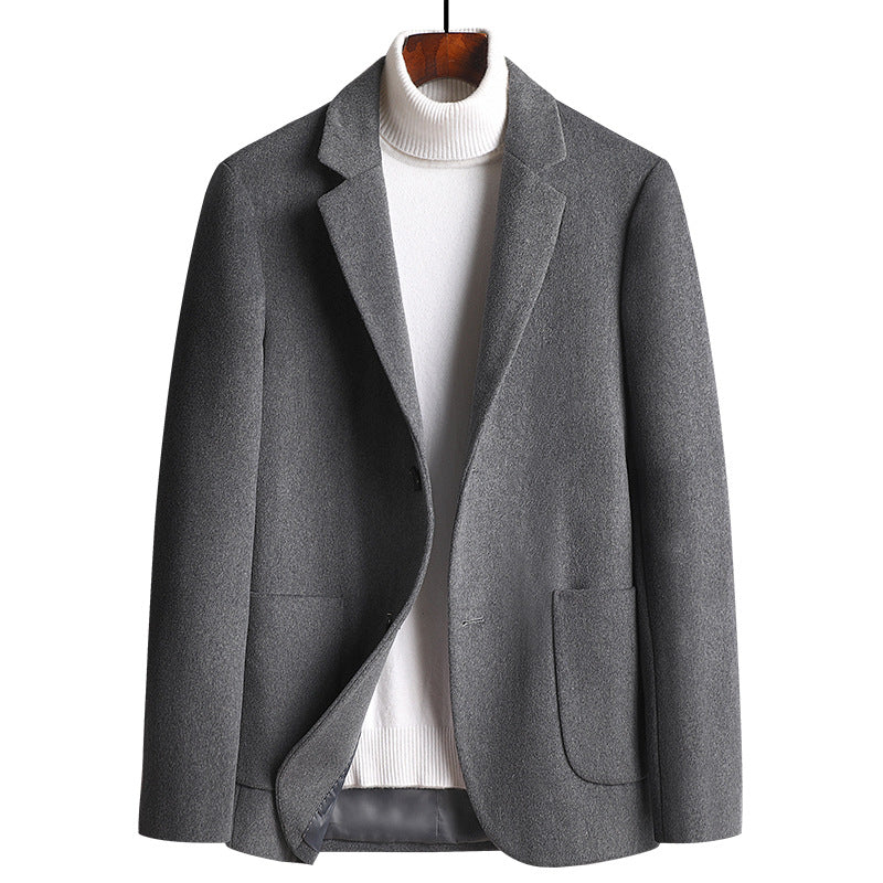 A gray wool blazer displayed with a white turtleneck underneath